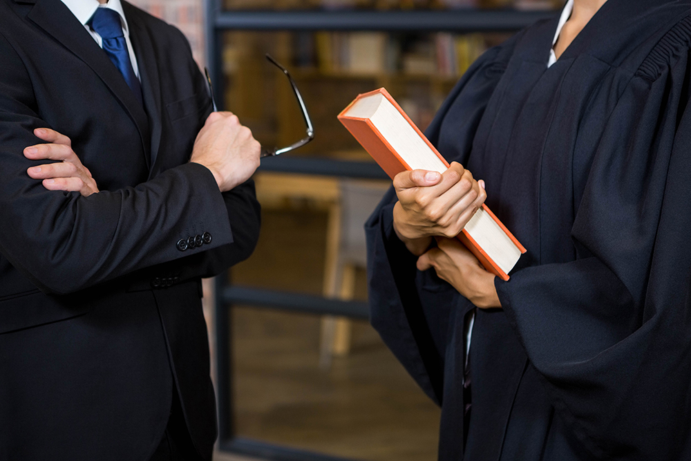 Lawyer holding a law book in office